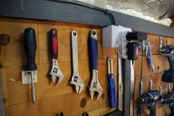 Professional tools organized on a workshop wall
