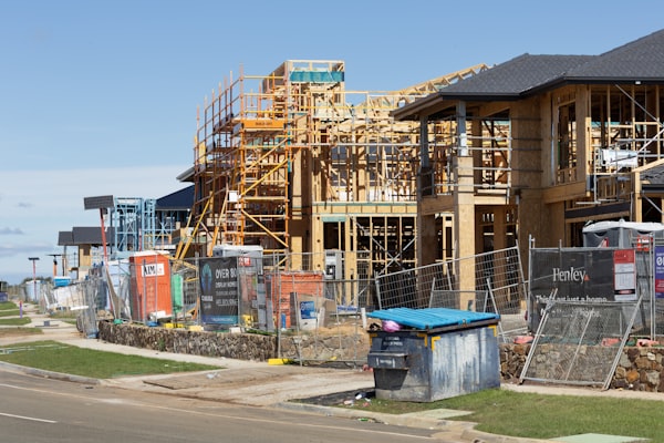 New residential houses under construction with wood framing